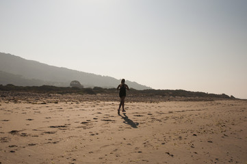 Fototapeta na wymiar morning jog women along the coast
