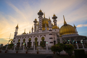 Beautiful Sunset Scenery at Royal Mosque Kuala Kangsar,Malaysia in Sillhoutte.Soft Focus,Blur due to Long Exposure.Visible Noise due to High ISO.