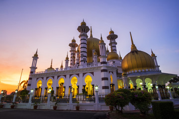Beautiful Sunset Scenery at Royal Mosque Kuala Kangsar,Malaysia in Sillhoutte.Soft Focus,Blur due to Long Exposure.Visible Noise due to High ISO.
