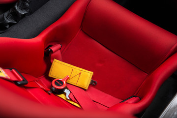 Close up of red bucket seat in sports car