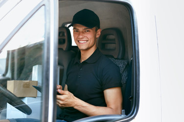 Delivery Courier In Car With Boxes. Man Delivering Packaging