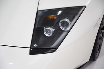 Headlight of white sports car