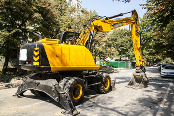 Excavator, hydraulics, tires, screws