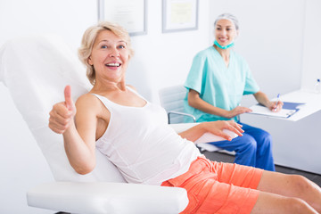 Woman satisfied with results of cosmetic procedures