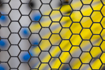 Server front side showing colorful switches and wiring View through the cooling grid Abstract blurred image for use as a background