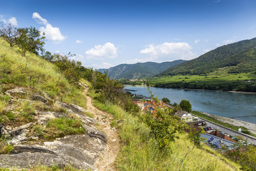 Obraz na płótnie Canvas The bank of the Danube River and blue sky. Wachau valley. Austria.