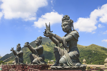 Fototapeta na wymiar Deva Statues Making Offerings to Tian Tan Buddha, Hong Kong