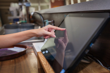 Touchscreen's cash register in the restaurant and commerce store - obrazy, fototapety, plakaty