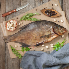 Smoked bream on a wooden table. Rustic style