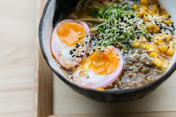 Traditional Asian food. Udon with corn, miso, eggs, nori. Ramen in a ceramic bowl