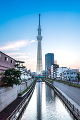 TOKYO, JAPAN - June 22, 2018: Tokyo Sky Tree, sunset and blue sky. Tokyo Sky Tree is one of the famous landmark in Tokyo. It is the tallest structure in world when built.