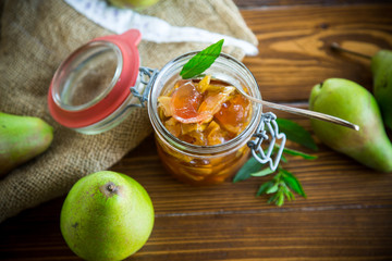 sweet fruit jam with apples and pears in a glass jar