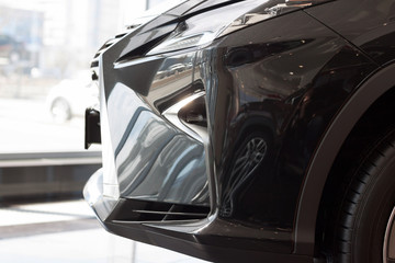 New vehicle with elegant head lamps. Side view.