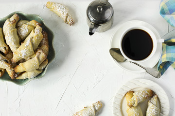 Rugelach with chocolate filling and cup of coffe, top view