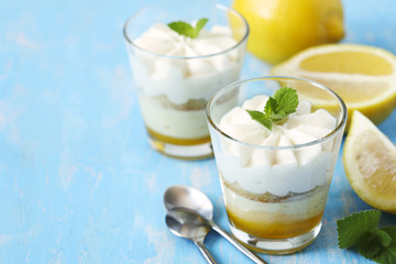 Limoncello - italian Dessert.  Lemon Cheesecake Mousse with Whipped Cream in cups. Summer dessert.