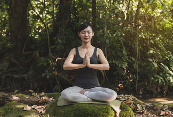 Young woman meditating in yoga.