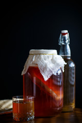 tea mushroom in a glass jar with tea
