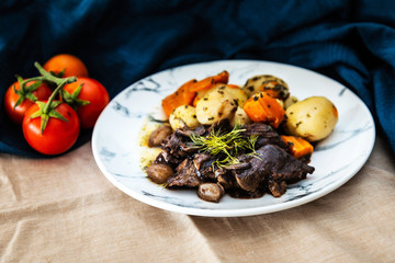 Beef meat stewed with potatoes-Traditional French cuisine Beef Bourguignon potatoes carrots in persillade
