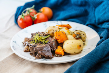 Beef meat stewed with potatoes-Traditional French cuisine Beef Bourguignon potatoes carrots in persillade