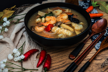 Bowls of Asian soup noodles and vegetables with Chopstick