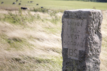 An old stone sign post in the Peak District, UK