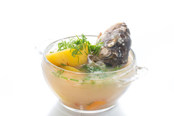 vegetable soup with fish in a glass bowl