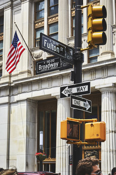 Sign post and traffic lights in downtown