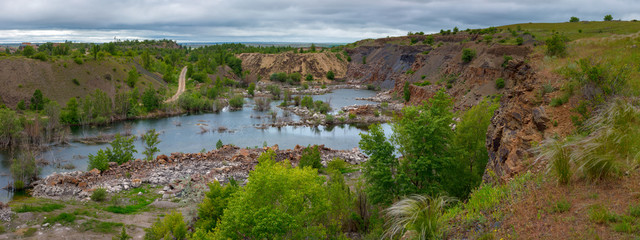 The beautiful scenery of abandoned sandstone quarry with the lake on the bottom