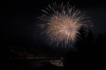 panoramic view of omegna during a fireworks display