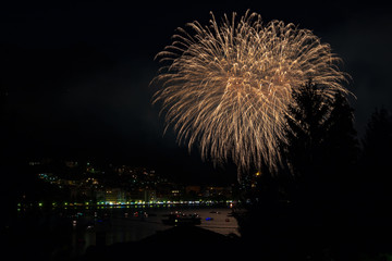 panoramic view of omegna during a fireworks display