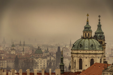 Fototapeta na wymiar Prague its domes and its fog. Czech Republic