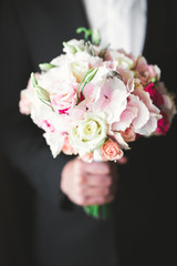 Beautiful wedding bouquet with different flowers, roses