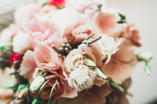 Two golden wedding rings isolated background concept