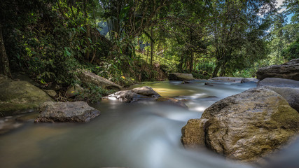 Naklejka na ściany i meble Rock Creek River Stream Waterfall In A Natural Park Outdoor
