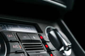 Air conditioning button inside a car. Climate control AC unit in the new car. Modern car interior details. Car detailing.