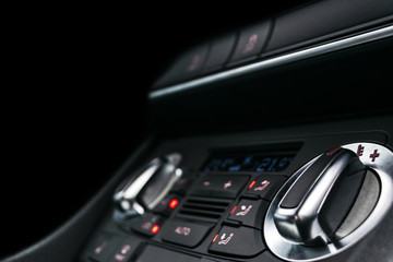 Air conditioning button inside a car. Climate control AC unit in the new car. Modern car interior details. Car detailing.