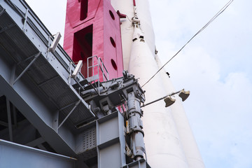Details of space rocket engine over blue sky background