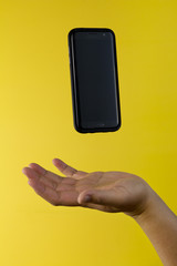 Smartphone Floating Over Hand