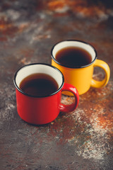 Enameled cup of hot tea