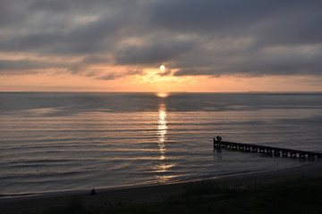 Fototapeta na wymiar Dark sunrise at the beach 