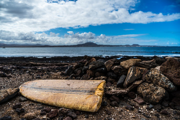 broken board on coast