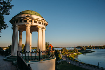 Fototapeta na wymiar Gazebo on the Volga embankment - an open round six-columned arbor-rotunda with a flattened dome, one of the symbols of Yaroslavl
