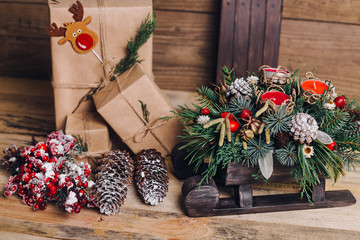 Christmas Gifts with Boxes on Wooden Background. Vintage Style. Closeup, selective focus. Toy,...