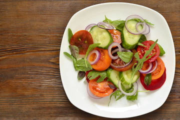 Colorful summer salad with fresh vegetables