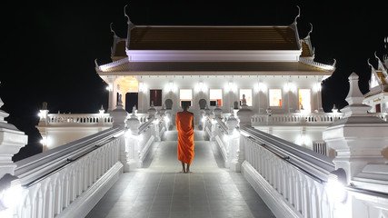 The buddhist monk Vipassana standing outside buddhist church or temple
