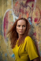 Fototapeta premium Redhead in a yellow dress