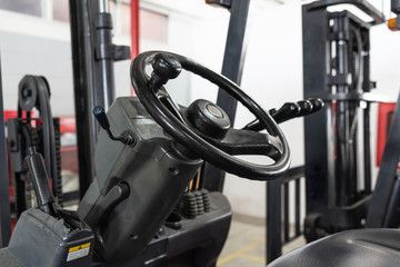 Close up of forklift steering wheel