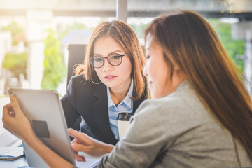 Business woman people presenting business planning or finance report from tablet for young ceo in...