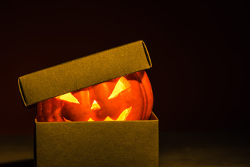 Close-up of halloween pumpkin in mysterious craft box
