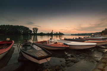 Fototapeta na wymiar Anchored boats on a river bank